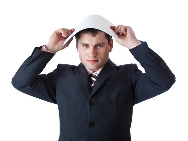 Ένας επιχειρηματίας ασκεί ένα κενό φύλλο χαρτί πάνω από το κεφάλι του — Φωτογραφία Αρχείου