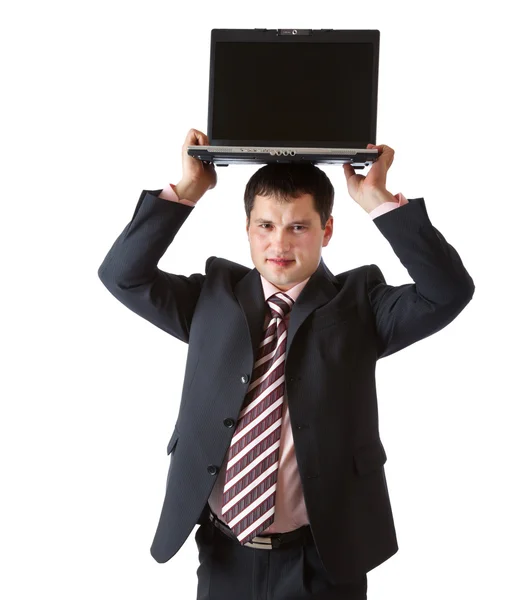 Un hombre de negocios sostiene el portátil por encima de su cabeza — Foto de Stock