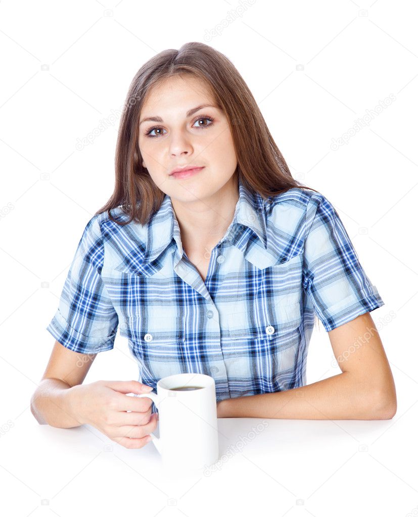 A smiling girl is drinking a coffee