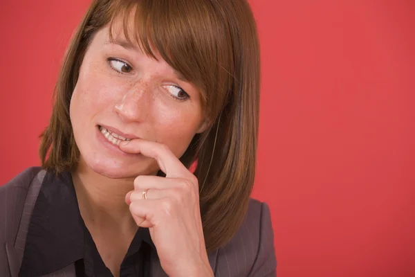 Nervous woman biting nails — Stock Photo, Image