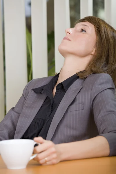 Relaxing woman in office — Stock Photo, Image