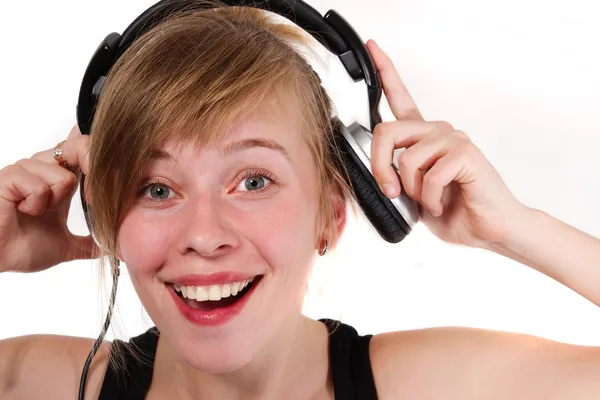 Retrato de uma menina em fones de ouvido — Fotografia de Stock