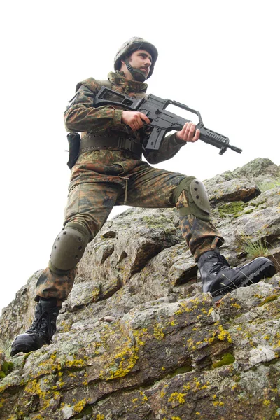 Soldier with a gun moving — Stock Photo, Image