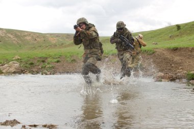 Soldiers running across the water clipart