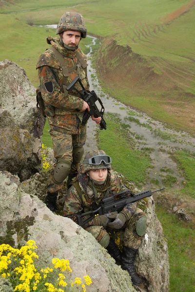 Soldiers in ammunitionon the cliff — Stock Photo, Image
