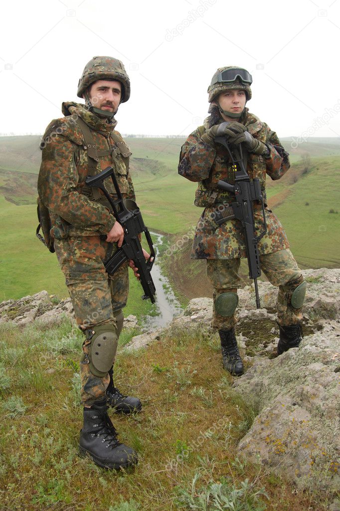 Two young soldiers outdoors