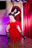 Stripper girl pole dancing in costume