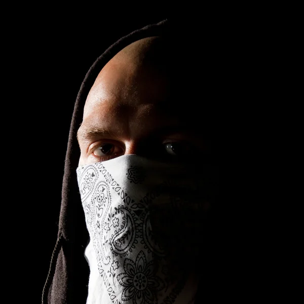 Portrait of a thug in mask at night — Stock Photo, Image