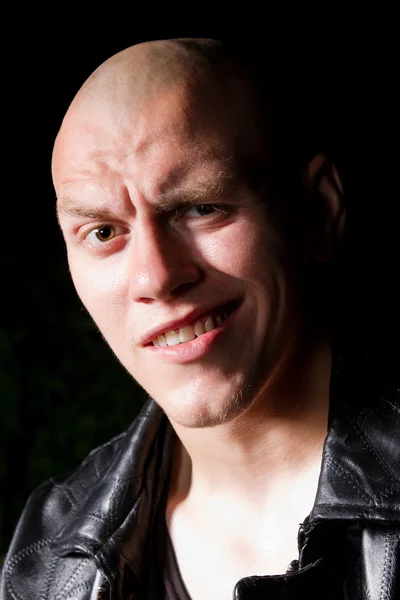 Portrait of a bald gangster in leather jacket — Stock Photo, Image