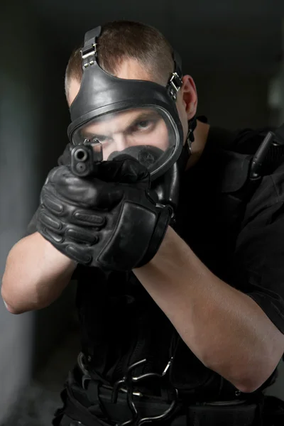 Soldier in gas mask targeting with 9mm pistol — Stock Photo, Image
