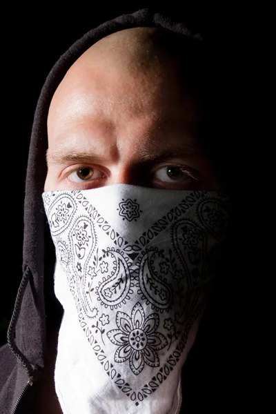 Portrait of a thug in mask at night — Stock Photo, Image