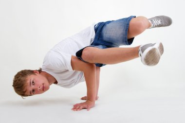 Teen b-boy standing in freeze on white clipart