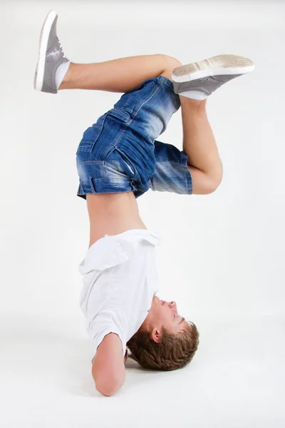 stock image Teen b-boy standing on his head in freeze