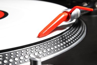 Turntable playing viyl record with music clipart