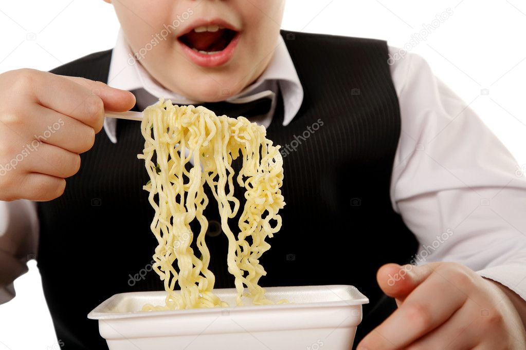 Boy eating instant noodles