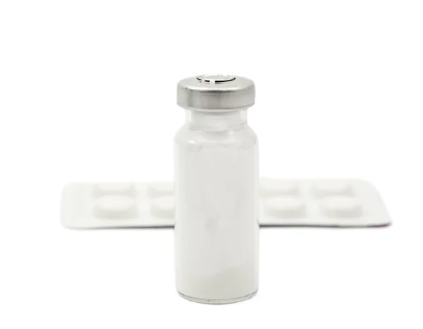 Vial and packaging of tablets — Stock Photo, Image