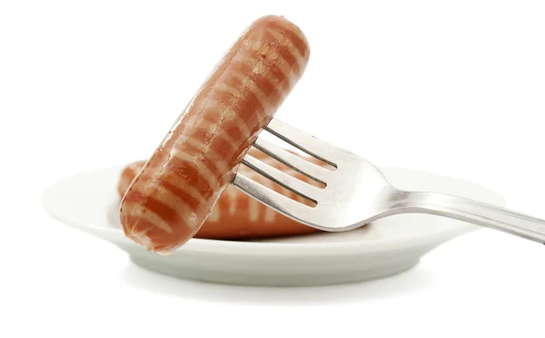 Salsicha em um garfo — Fotografia de Stock