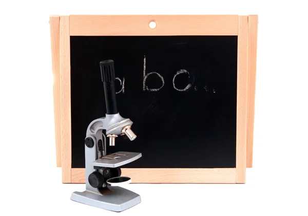 School board with a microscope — Stock Photo, Image