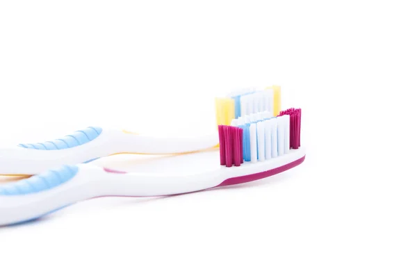 Rode en gele tandenborstels — Stockfoto