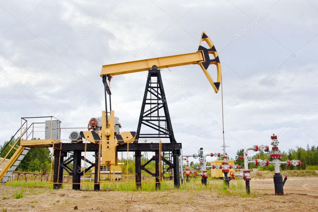 Pump jack and oil well.