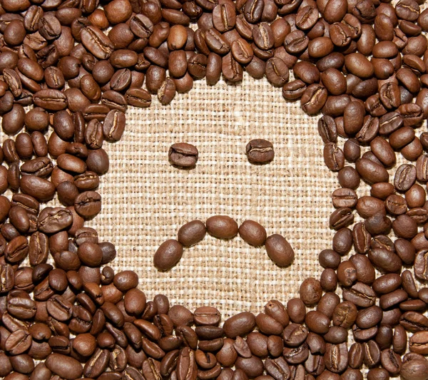 Kaffeebohnen trauriges Lächeln — Stockfoto