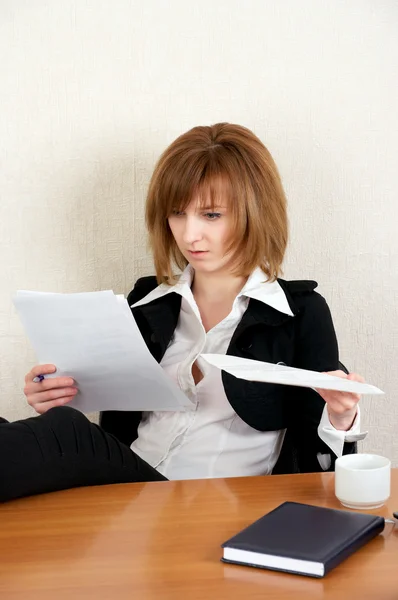 stock image Businesswoman reading document at office