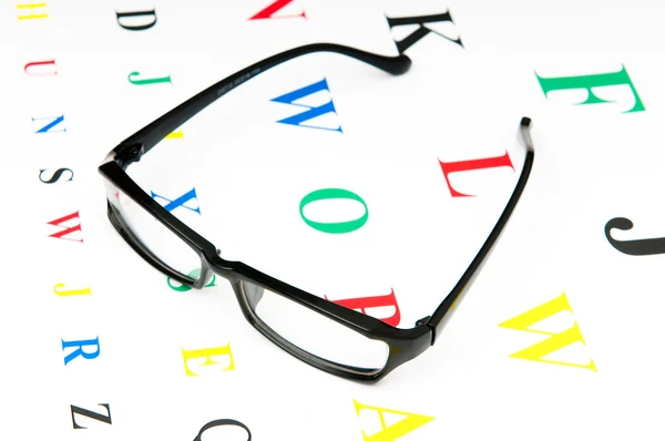 Optikai olvasó szemüveg, látás-tábla — Stock Fotó