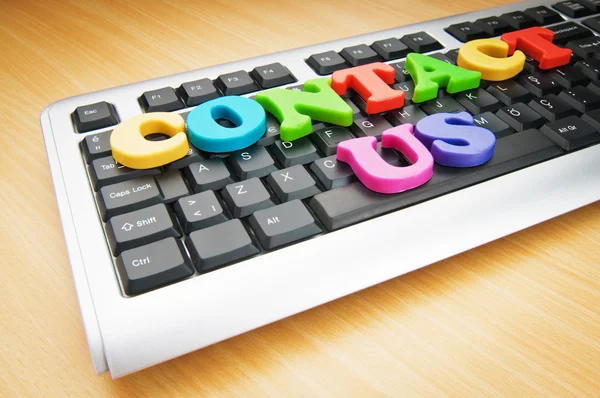Contact us concept with letters on keyboard — Stock Photo, Image
