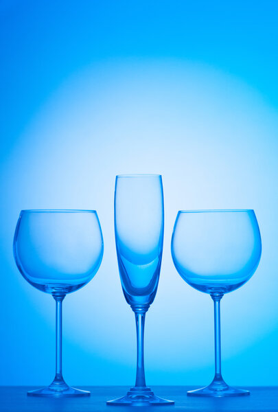 Wine glasses against gradient background