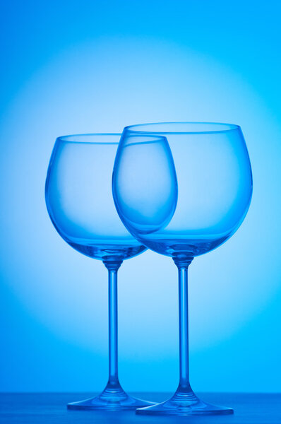 Wine glasses against gradient background