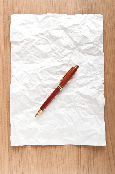 Бумажный фон с ручкой — стоковое фото
