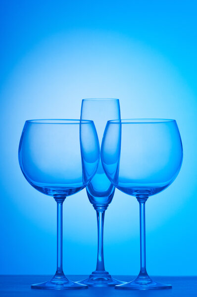 Wine glasses against gradient background