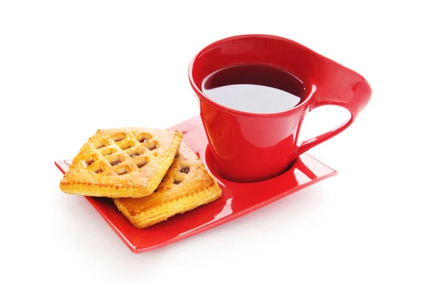 Egy csésze tea és friss süti az asztalon. — Stock Fotó