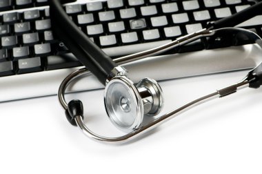 Stethoscope and keyboard illustrating concept of digital securit clipart