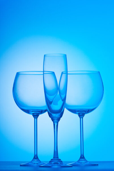 Wine glasses against gradient background