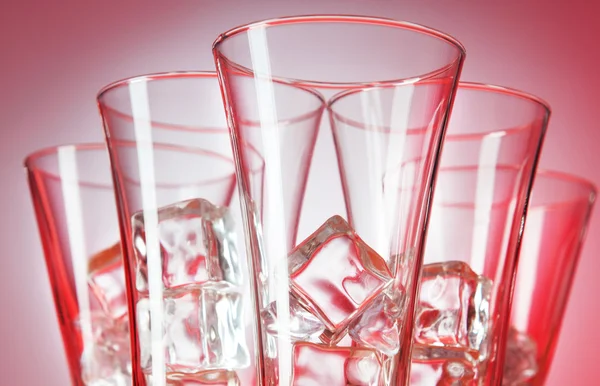 Glasses of water against gradient background — Stock Photo, Image