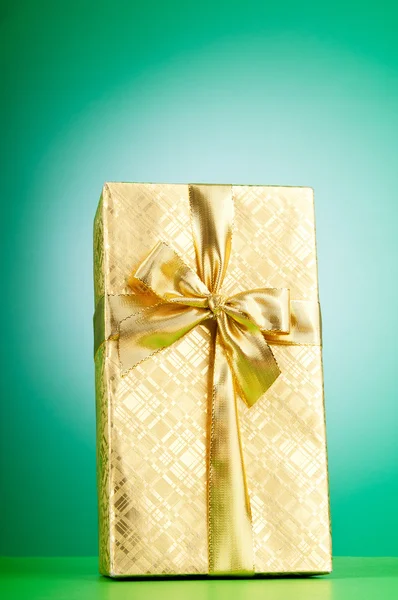Celebration concept - Gift box against colorful background — Stock Photo, Image