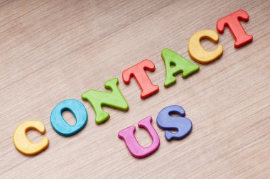 Contact us concept with letters on background clipart