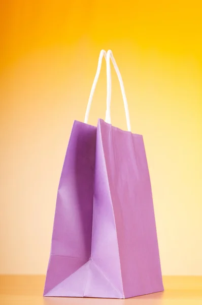 Nákupní tašky proti barevných přechodů — Stock fotografie