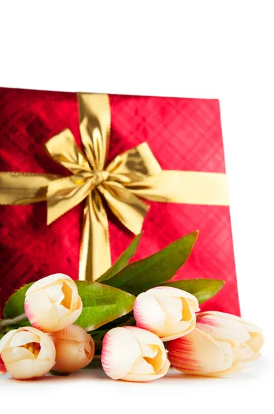 Celebration concept - gift box and tulip flowers Royalty Free Stock Photos