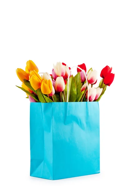 Tulipanes en la bolsa aislados en blanco — Foto de Stock
