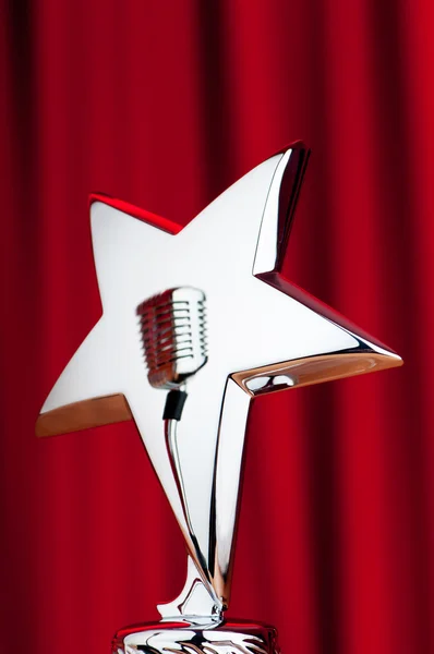 Star award against curtain background — Stock Photo, Image