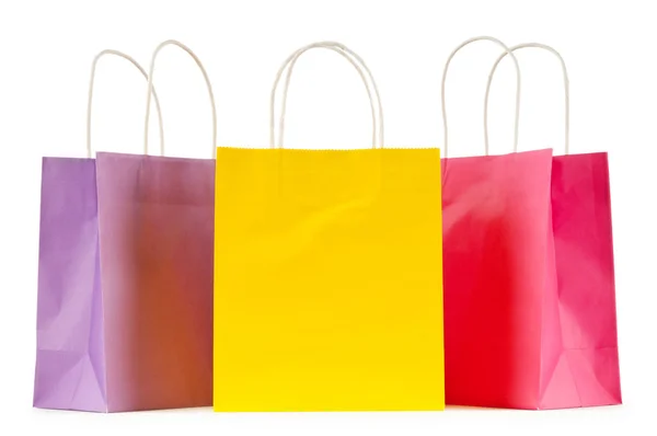 Colourful paper shopping bags isolated on white Royalty Free Stock Images