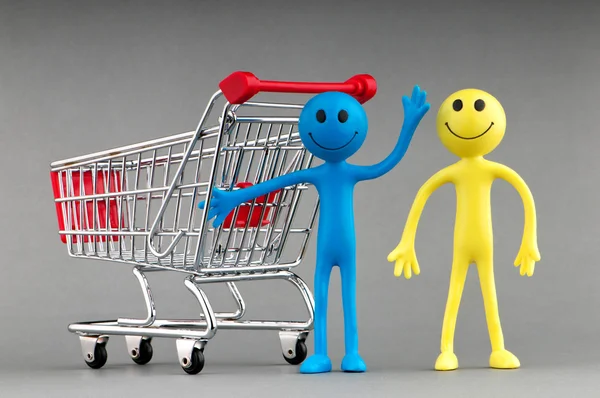 Happy family with shopping cart Stock Photo