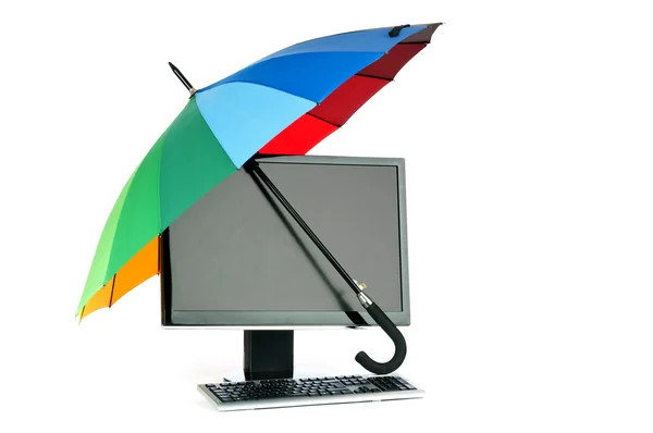 Stock image Computer under protection of umbrella