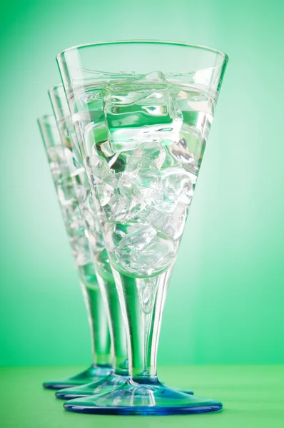 Water in the glass against gradient background — Stock Photo, Image