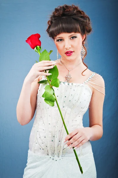 Beautiful bride with rose in studio shooting — Stock Photo, Image