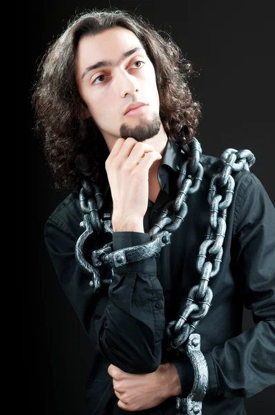 Man with metal chain around him — Stock Photo, Image