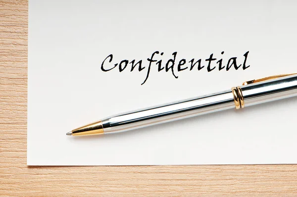 stock image Pen and confidential message on white