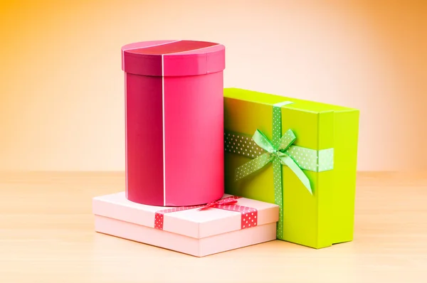 Giftboxes against gradient background — Stock Photo, Image
